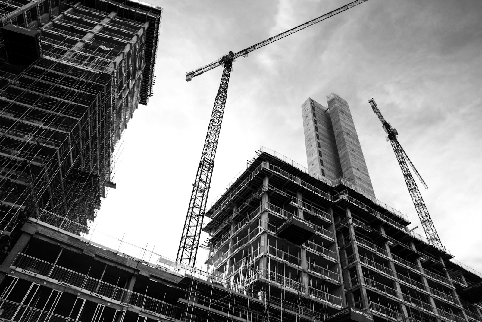 Construction crane in front of a high-rise building under development